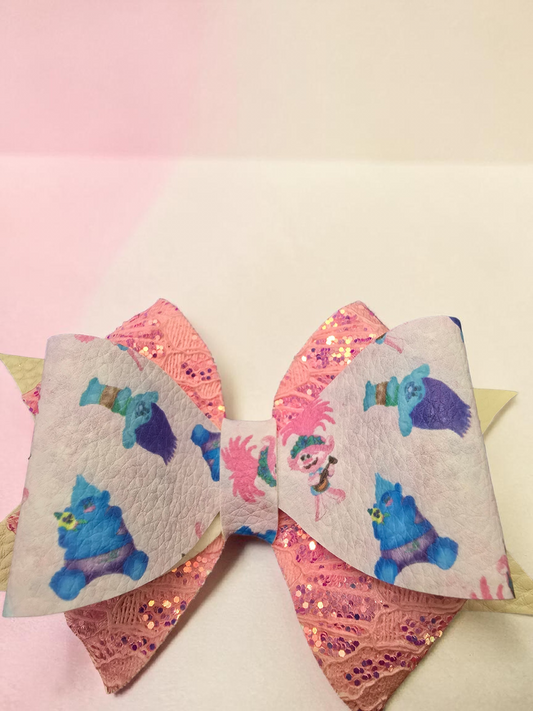 Poppy Single Hair Bow with a Pink Glitter Background